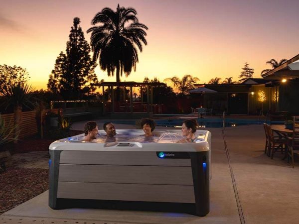 Friends in a Hot Spring hot tub sunset