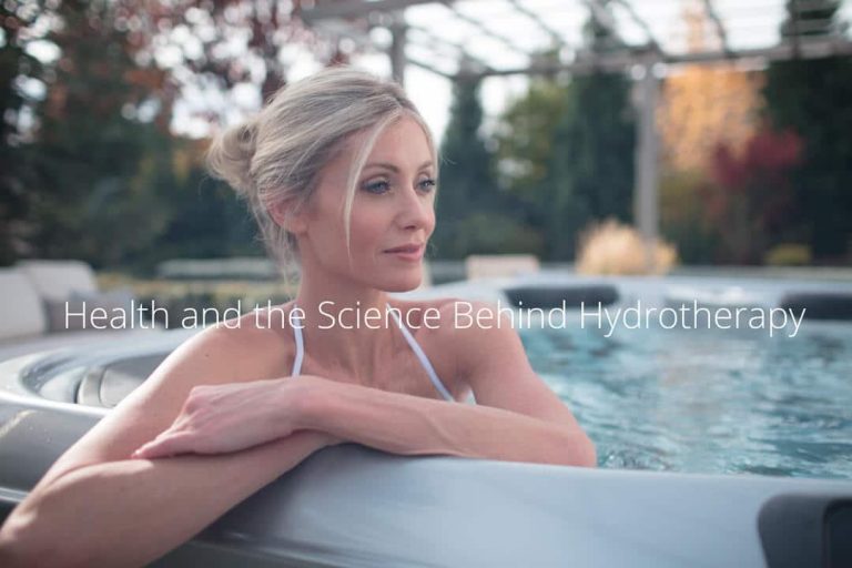 A woman is in a hot tub outside in a backyard. There is text over her that says "Health and the Science Behind Hydrotherapy"